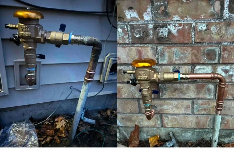 Exterior water shut-off valves and pipe fittings on a home's foundation wall.