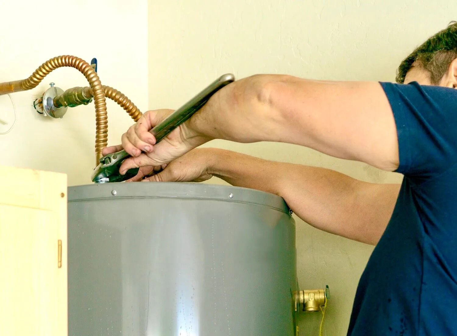 Spokane, WA plumber installing a water heater.